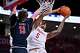 FILE - Houston forward Chris Cenac Jr. (5) shoots the ball as Arizona center Motiejus Krivas (13) defends in the second half of an NCAA college basketball game, Feb. 21, 2026, in Houston. (AP Photo/Maria Lysaker, File)