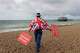 FILE- Anti Brexit campaigner Steve Bray walks on the beach to pose for a photograph during the Labour Party Conference at the Brighton Centre in Brighton, England, Monday, Sept. 23, 2019.
