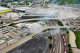 A dust cloud rises from demolition work between the the Houston Street (bottom) and Jefferson Boulevard viaducts related to the construction of the new Kay Bailey Hutchison Convention Center in Dallas. Photo taken June 15, 2026.
