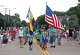 Cub Scout Pack 719 from St. Patrick's Catholic Church marched with flags in the Exchange Club of Lake Highlands' Fourth of July parade in 2021.
