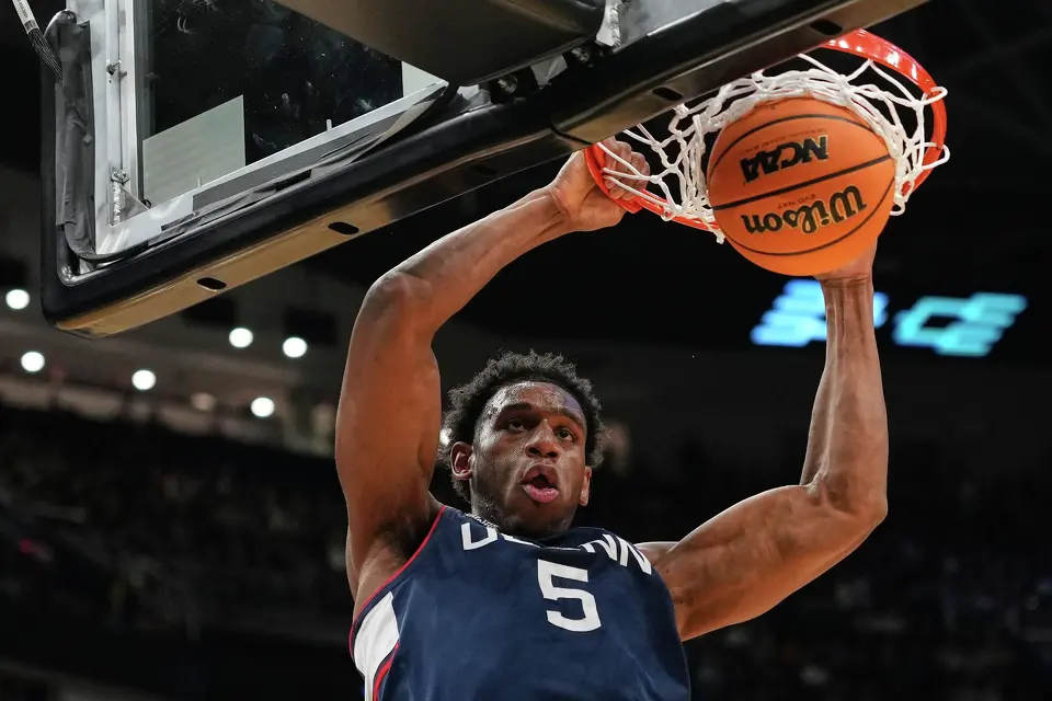 UConn forward Tarris Reed Jr. (5) dunks during the second half against Duke in the Elite Eight of the NCAA college basketball tournament, Sunday, March 29, 2026, in Washington. (AP Photo/Abbie Parr)