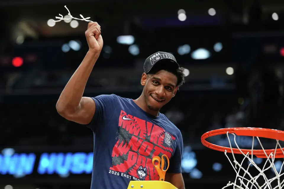 UConn forward Tarris Reed Jr. cuts the net after the team's win against Duke in the Elite Eight of the NCAA college basketball tournament, Sunday, March 29, 2026, in Washington. (AP Photo/Abbie Parr)