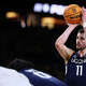 INDIANAPOLIS, INDIANA - APRIL 06: Alex Karaban #11 of the UConn Huskies shoots a free throw against the Michigan Wolverines in the National Championship of the 2026 NCAA Men's Basketball Tournament.