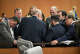 Attorney Mikal Watts, middle, back to camera, talks to Camp Mystic directors and others during a break in a hearing about a temporary injunction at the Travis County Courthouse in Austin on Wednesday, March 4, 2026. Will and CiCi Steward of Austin, whose 8-year-old daughter, Cile Steward, was swept away in the July 4, 2025, flash flood at Camp Mystic and has not been found, are seeking to prevent the camp from reopening this summer and to halt repairs and construction until their lawsuit against the camp and other parties goes to trial. The Stewards say they want to preserve potential evidence related to their daughter’s death.