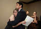 Katherine Hoffman hugs her husband Robert Lindsey after she testified at a joint House and Senate flood investigating committee hearing at the Capitol on Tuesday April 28, 2026. Their daughter survived the flood at Camp Mystic.