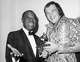FILE - Louis Armstrong, left, presents a Grammy Award to David Clayton-Thomas, lead singer of the rock group "Blood, Sweat and Tears", in New York, March 11, 1970.