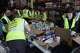 Volunteers are seen packaging supplies, Thursday, June 25, 2026, in Doral, Fla.