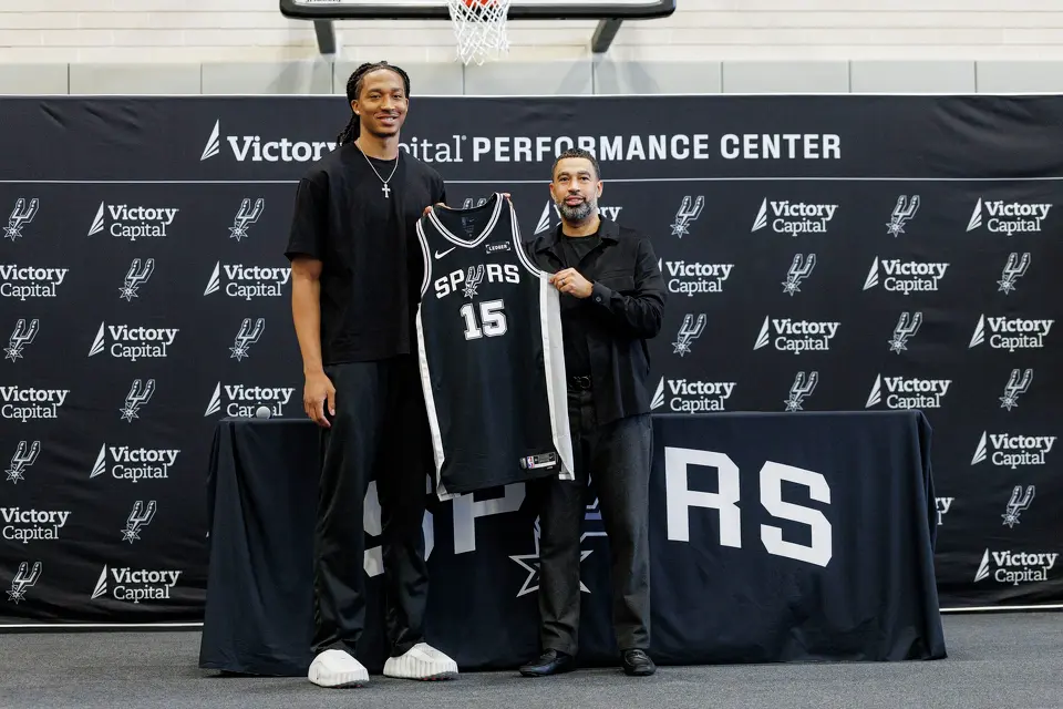 San Antonio Spurs rookie Maliq Brown poses for a picture with Spurs general manager Brian Wright during a news conference at Victory Capital Performance Center in San Antonio, Thursday, June 25, 2026.
