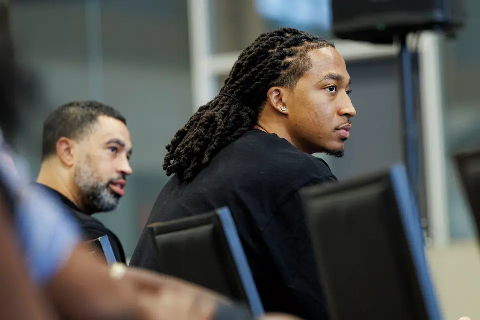 San Antonio Spurs rookie Maliq Brown sits beside Spurs general manager Brian Wright during a news conference at Victory Capital Performance Center in San Antonio, Thursday, June 25, 2026.
