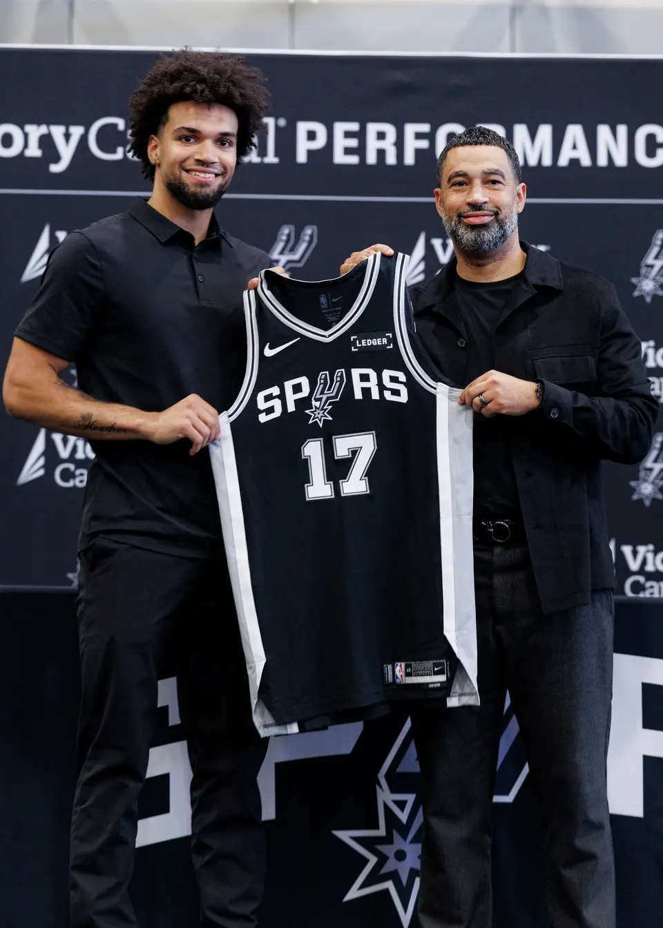 San Antonio Spurs rookie Ja’Kobi Gillespie poses for a picture with Spurs general manager Brian Wright during a news conference at Victory Capital Performance Center in San Antonio, Thursday, June 25, 2026.