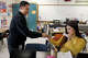 Skyline High students Samuel Estrada and Alejandra Ordaz role-play to analyze real-world economic concepts during a personal financial literacy class at Skyline High School on March 12, 2026, in Dallas.