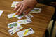 Teacher Julie Harris uses cards to help students analyze real-world economic concepts during her personal financial literacy class at Skyline High School on Thursday, March 12, 2026, in Dallas.