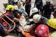 Rescue workers place Daniel Cordero on a stretcher after pulling him from the rubble two days after an earthquake struck Catia la Mar, Venezuela, Friday, June 26, 2026.