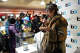 Participant Ashley Terry explains her piece “Remnants of a Festival Romance,” during Bart Basel 2022 in San Francisco on Dec. 3, 2022. The event was one of many the transit system hosted to lure back riders after the COVID-19 pandemic, a tactic it has continued to earn favor ahead of a crucial ballot initiative.