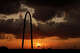 The sun sets through a thin layer of Saharan dust behind the Margaret Hunt Hill Bridge as clouds from an approaching storm roll into downtown Dallas, Wednesday, July 14, 2021. Another batch of dust is traveling over the Caribbean and Cuba and may make its way to Texas this weekend.