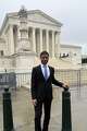 Lesly Miot stands outside the U.S. Supreme Court. He was a lead plaintiff in a case heard before justices over temporary legal protections given to Haitian and Syrian immigrants.