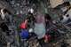 Residents pull a body from the rubble two days after earthquakes struck La Guaira, Venezuela, Friday, June 26, 2026.