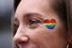 Raff Esoesto dons a Pride heart sticker as she prepares to watch the Valkyries play the Atlanta Dream on Friday with her wife and three children during Pride Night at Chase Center.