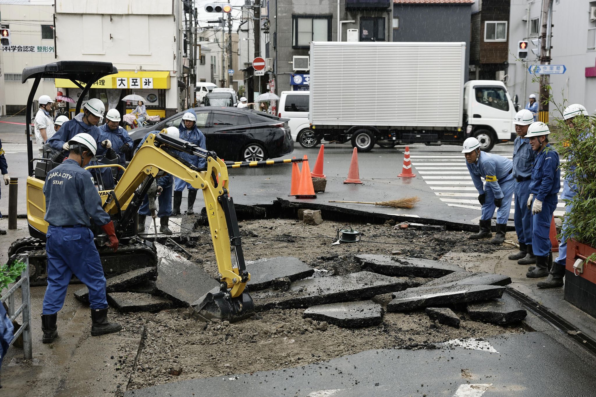 2 tropical storms pound Japan with floods and landslides, killing 1
