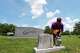 Lisa McNair arranges flowers on the grave of her late sister, Carol Denise McNair, Monday, June 1, 2026, in Birmingham, Ala.