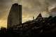 A man stands atop a mountain of rubble three days after twin earthquakes struck, in La Guaira, Venezuela, Saturday, June 27, 2026.