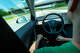 Tesla manuals tell drivers to keep their hands on the wheel and eyes on the road when Full Self-Driving is engaged, but not all drivers do. The system’s camera-only system is under investigation for its involvement in fatal crashes.