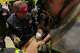 U.S. firefighters from the Fairfax County search and rescue team pull a boy from the rubble after rescuing him and his father from a building that collapsed in the earthquakes in La Guaira, Venezuela, Sunday, June 28, 2026.
