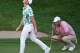 Viktor Hovland, left, reacts after just missing his birdie putt for the win as Scottie Scheffler looks over his line on Hole 18 during the final round of the Travelers Championship at TPC River Highlands in Cromwell, Conn., Sunday, June 28, 2026. Scheffler made his par putt and forced a playoff. The playoff was suspended due to darkness and will commence Monday morning at 9 a.m.