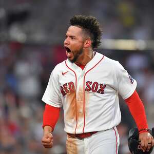 A bat flip, a shout of 'Venezuela' and tears for home as Red Sox 1B Willson Contreras plays on