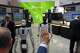 A visitor reacts near robots at the Nvidia booth during the China International Supply Chain Expo in Beijing on June 22, 2026.