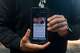 Gabriel Martinez Garcia, 30, poses with an email advertisement from attorney Lozano displayed on his phone in Tenino, Wash., on Sunday, June 14, 2026. .