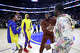 FILE: Draymond Green and Stephen Curry of the Golden State Warriors joke with Anthony Davis and LeBron James of the Los Angeles Lakers after their preseason game at Chase Center on Oct. 7, 2023, in San Francisco.