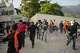 Residents and rescuers searching for survivors run as an aftershock shakes the area five days after back-to-back earthquakes struck La Guaira, Venezuela, Monday, June 29, 2026.