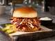 Dickey's Barbecue Pit is offering discounts on online and app orders. In the photo, Dickey's Pickle ranch pulled pork sandwich
