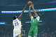 Anthony Davis of the Dallas Mavericks shoots over Draymond Green of the Golden State Warriors in the first half at Chase Center on Dec. 25, 2025, in San Francisco.