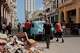 A group of people push a broken-down classic American car past a pile of trash in Havana. One factor is central to the Cuban regime’s refusal to negotiate with Americans: the deep anti-U.S. doctrine that is at the heart of the regime, writes Daniel Batlle.