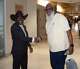 VA North Texas Health Care System Associate Director James Douglas (left) shares a handshake with a veteran.