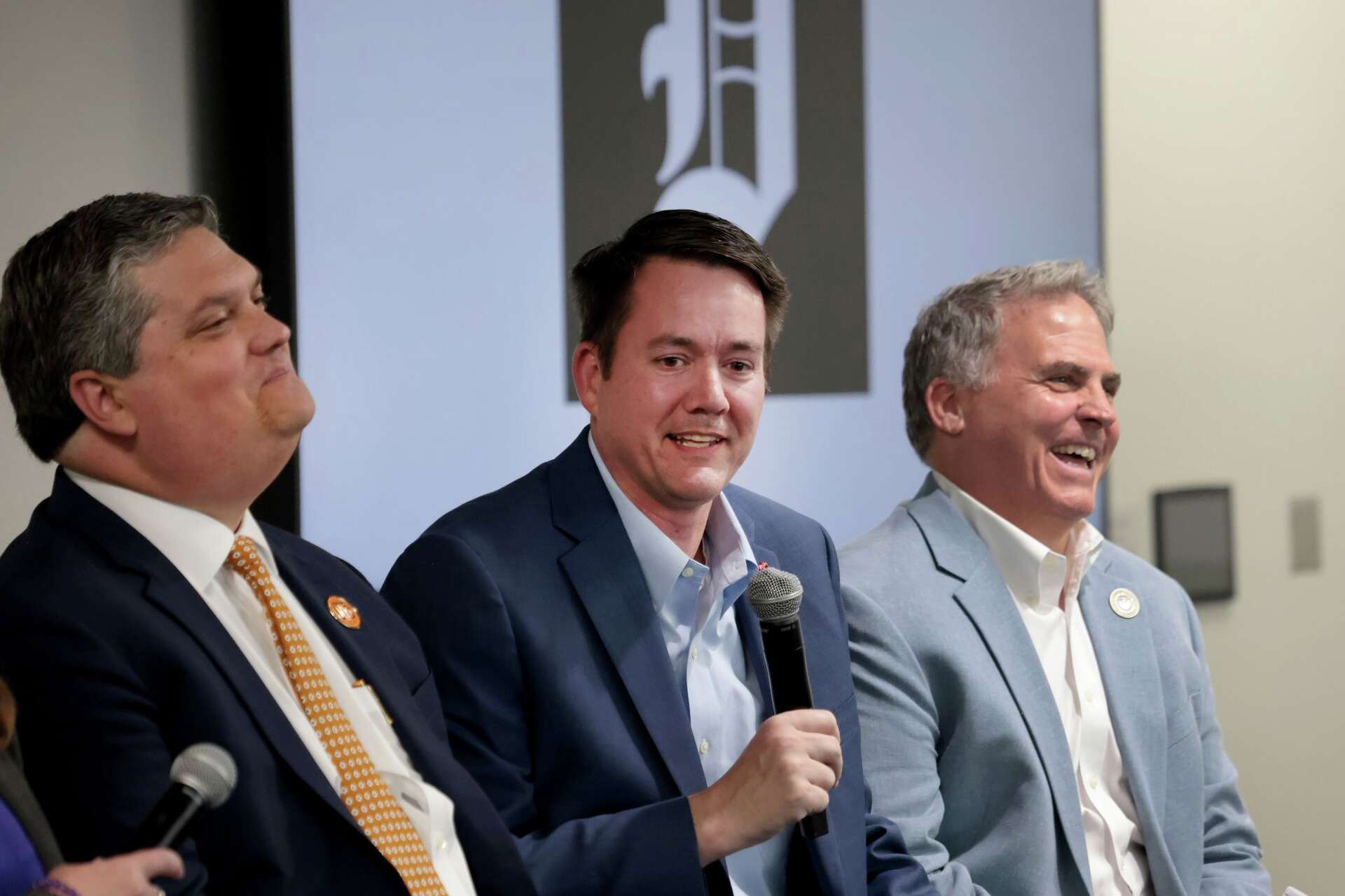 Michael Harris (center), dean of SMU’s Simmons School of Education and Human Development, shares a light moment with fellow panelists Marc Christensen (left), t