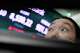 A currency trader watches monitors near a screen showing the Korea Composite Stock Price Index (KOSPI) at the foreign exchange dealing room of the Hana Bank headquarters in Seoul, South Korea, Wednesday, July 1, 2026.