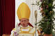 Newly consecrated Bishop Michael Goldade delivers his blessing at the end of his consecration ceremony in a tent set up outside the Society of St. Pius X seminary in Econe, Switzerland, Wednesday, July 1, 2026.