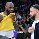LeBron James speaks with Stephen Curry following a basketball game between the Los Angeles Lakers and the Golden State Warriors at Crypto.com Arena.