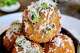 Visit Renny's Bar and Grill near Dallas' Preston Hollow in July 2026 for a $49 meal that benefits victims of the Texas Hill Country floods. The three-course dinner starts with the option of basil pesto arancini (pictured).