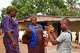 Kazaliou Balde, right, gestures outside his home while standing with his mother, Kadiatou Diallo, left, and Houssainatou Diallo, an advocate and communicator dedicated to supporting children with autism, in Fria, Guinea, Saturday, May 16, 2026.