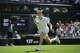 Jannik Sinner of Italy returns the ball to Miomir Kecmanovic of Serbia during the men's singles match at the Wimbledon Tennis Championships in London, Monday, June 29, 2026.