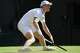 Jannik Sinner of Italy slides on the court during the third round men's singles match against Jenson Brooksby of the United States at the Wimbledon Tennis Championships in London, Friday, July 3, 2026.