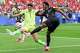 Morocco goalkeeper Yassine Bounou (1) defends a shot on goal by Canada forward Jonathan David (10) during the first half of a World Cup round of 16 soccer match in Houston, Saturday, July 4, 2026.