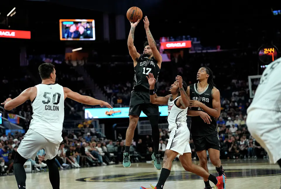 SAN FRANCISCO, CALIFORNIA - JULY 03: Ja'Kobi Gillespie #17 of the San Antonio Spurs shoots a three-point shot over Jahmir Young #17 of the Miami Heat during the second half in the California Classic, an NBA Summer League game, at Chase Center on July 03, 2026 in San Francisco, California.