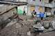 Local residents walk amid debris following a Russian missile attack in Kyiv, Ukraine, Monday, July 6, 2026.