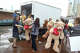 Dallas Public Library staff members and volunteers load stuffed animals from the makeshift memorial outside Jack Evans Police Headquarters into a delivery truck in Dallas on July 15, 2016. The tributes were among items left for the five officers killed in the downtown ambush the week before.