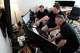 Andrew Leeper, left, Will Minkoff and Tom Johnstone, right, of Nashville Severe Weather, look over weather data Monday, April 20, 2026, in Nashville, Tenn.